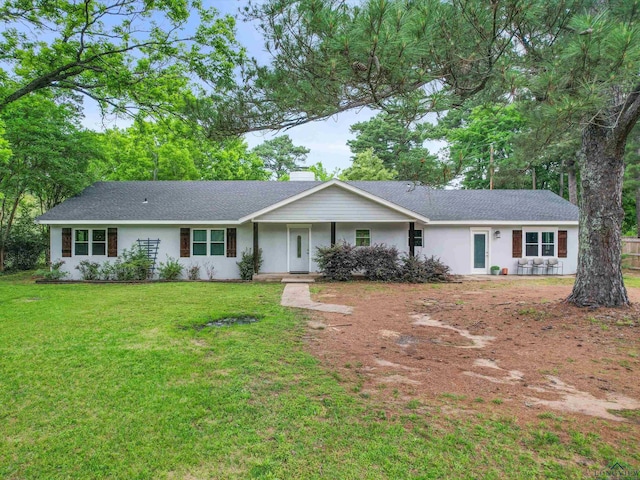 ranch-style home featuring a front yard