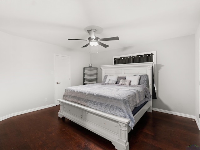 bedroom featuring ceiling fan and dark hardwood / wood-style floors