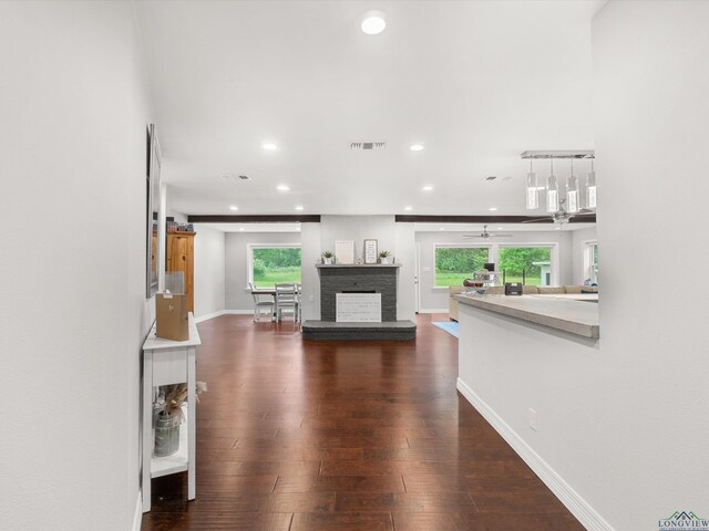 interior space with plenty of natural light and dark wood-type flooring