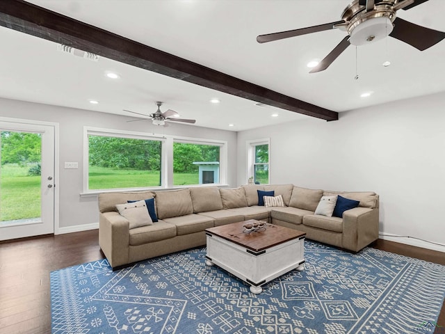 living room with hardwood / wood-style floors and beam ceiling