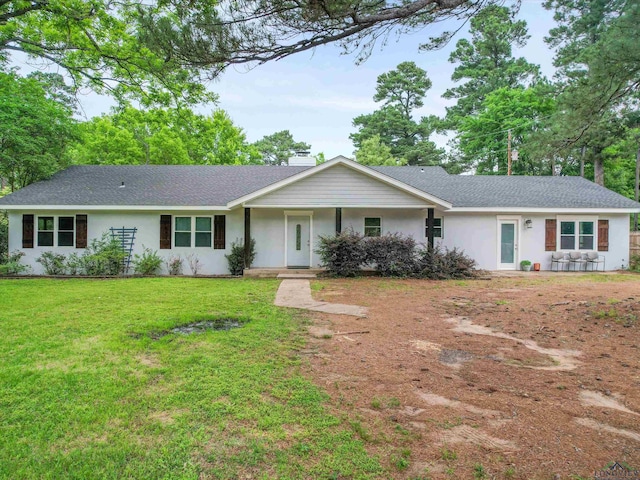 ranch-style house with a front lawn