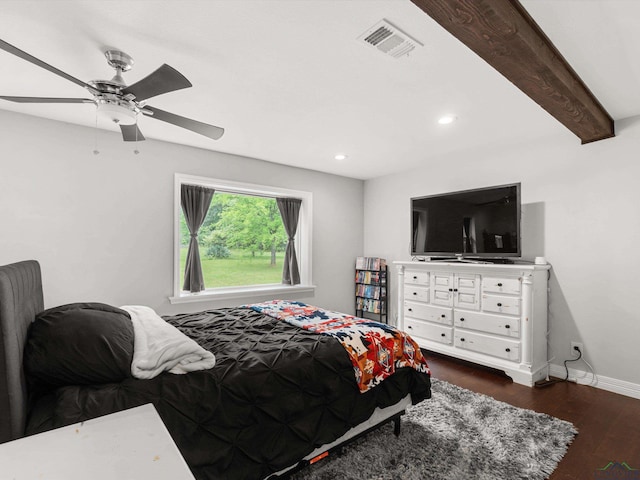 bedroom featuring beamed ceiling, dark hardwood / wood-style flooring, and ceiling fan