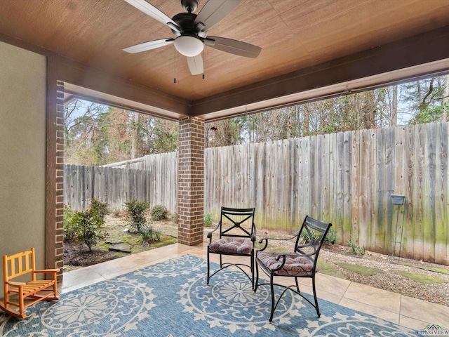 view of patio featuring ceiling fan