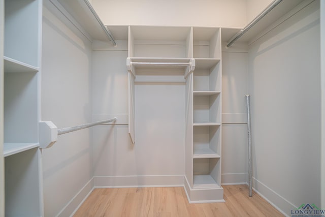 walk in closet featuring light wood-type flooring