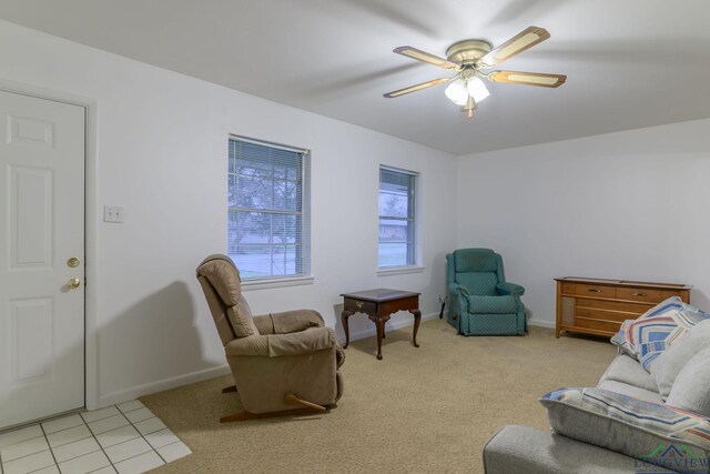 living room with ceiling fan and light carpet