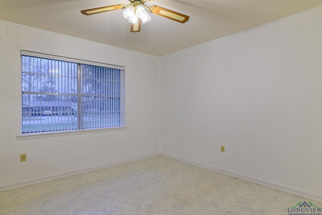 unfurnished room with ceiling fan