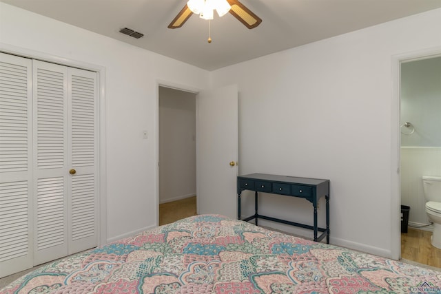 bedroom featuring a closet, ceiling fan, and ensuite bathroom