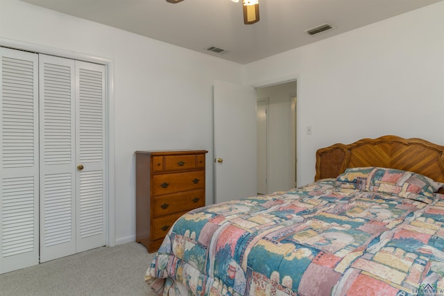 carpeted bedroom with ceiling fan and a closet