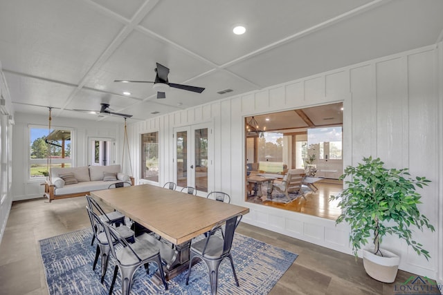 dining space featuring recessed lighting, a decorative wall, coffered ceiling, visible vents, and french doors