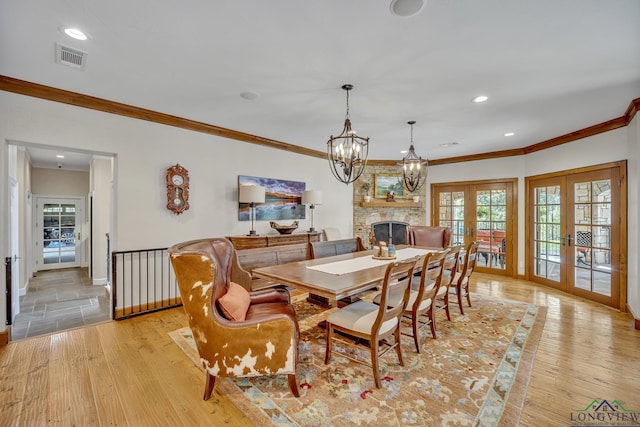 dining room featuring french doors, light wood-type flooring, and recessed lighting