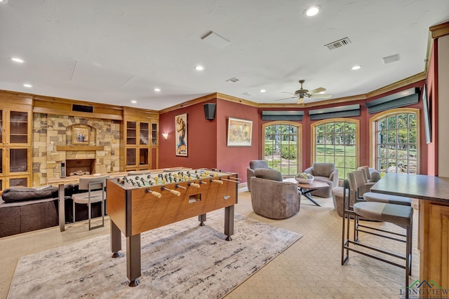 playroom featuring recessed lighting, visible vents, and a stone fireplace