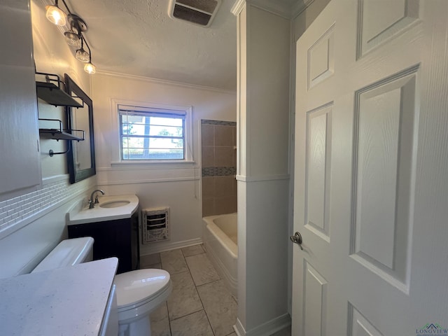 bathroom featuring toilet, visible vents, a tub to relax in, heating unit, and vanity