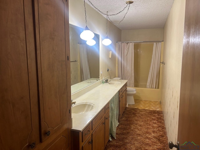 full bathroom featuring shower / tub combo with curtain, vanity, a textured ceiling, and toilet