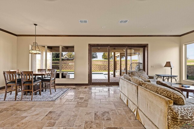 interior space with crown molding and a wealth of natural light