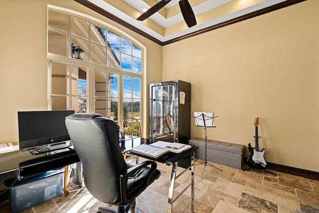 office featuring ceiling fan, crown molding, and a high ceiling