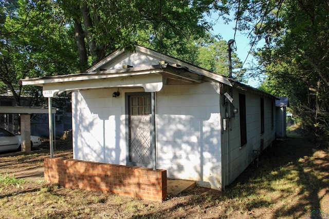 view of property exterior featuring an outbuilding