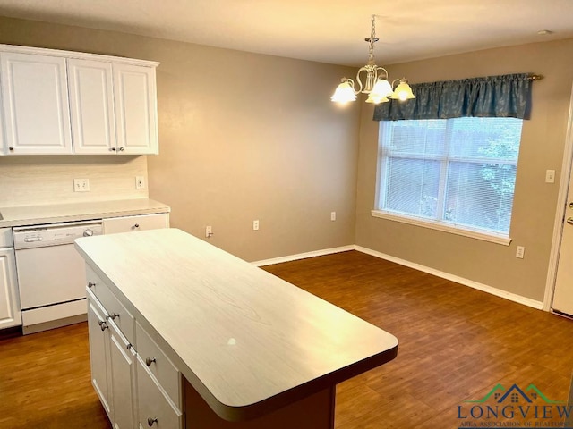 kitchen featuring dishwasher, white cabinetry, dark hardwood / wood-style floors, a notable chandelier, and a kitchen island