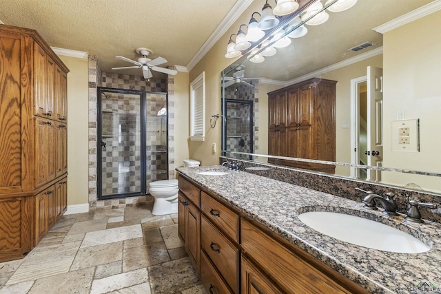 bathroom featuring vanity, toilet, ornamental molding, a textured ceiling, and an enclosed shower