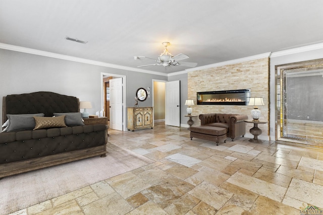 living room with ceiling fan, a stone fireplace, and ornamental molding