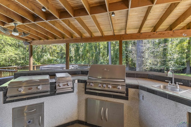 view of patio / terrace with area for grilling and sink