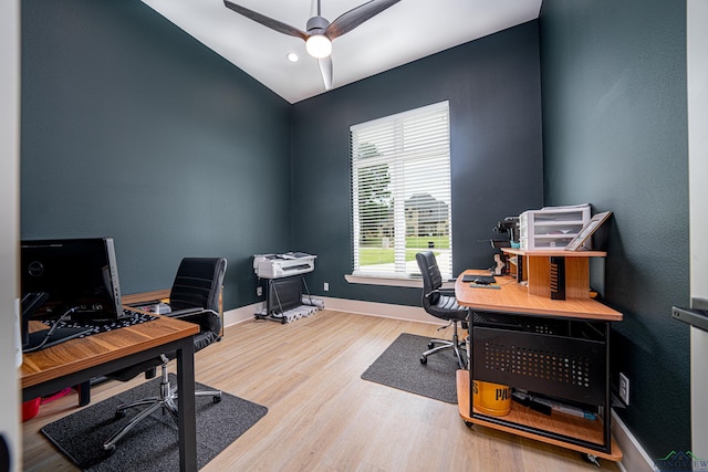 office space featuring ceiling fan, wood-type flooring, and lofted ceiling