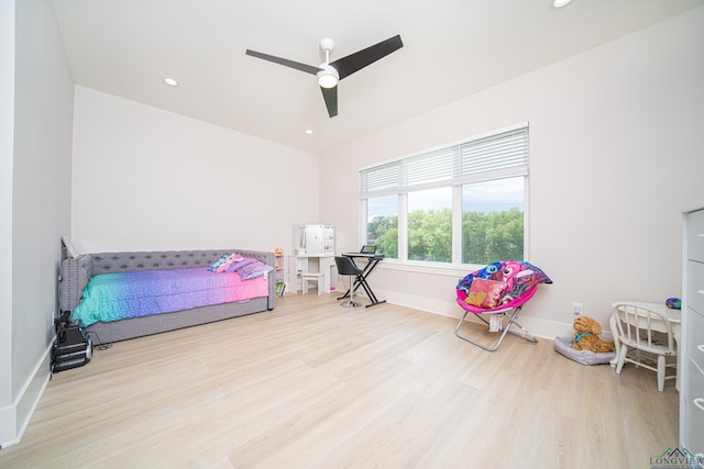 bedroom featuring ceiling fan and light hardwood / wood-style flooring