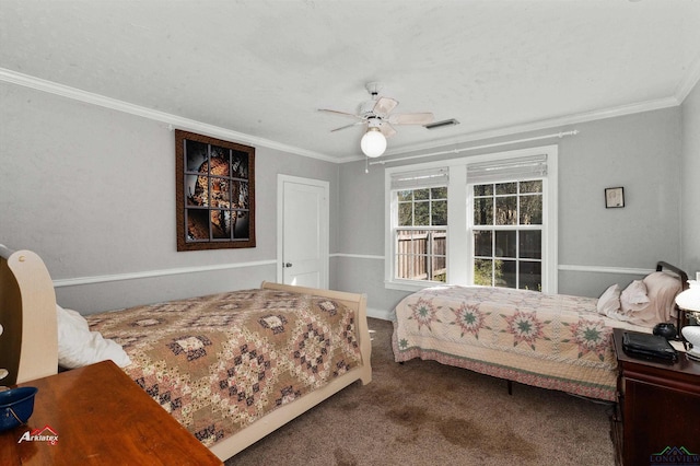 carpeted bedroom with ceiling fan and crown molding