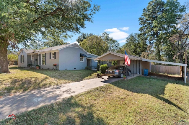 ranch-style house with a front yard and a carport