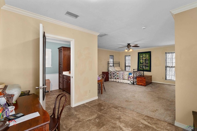 carpeted bedroom featuring ensuite bathroom, ceiling fan, and ornamental molding