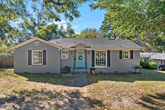 ranch-style home featuring a front yard