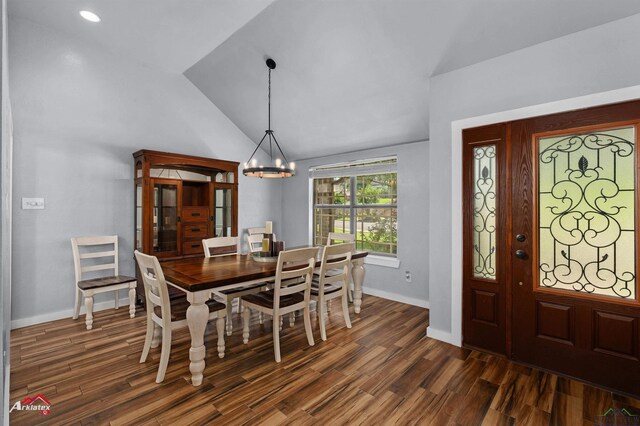 3718 Ben Hogan Dr, Longview, TX 75605 - dining space with lofted ceiling, dark wood-style floors, a chandelier, and baseboards