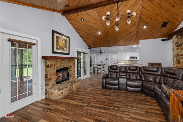 3718 Ben Hogan Dr, Longview, TX 75605 - living room with a stone fireplace, wood ceiling with exposed beams, high vaulted ceiling, dark wood-style flooring, and a chandelier