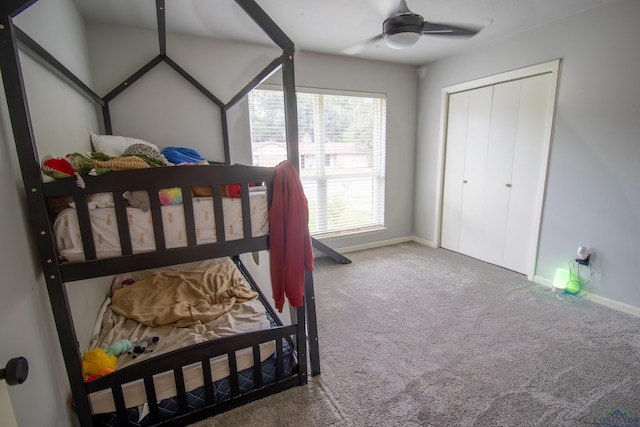 carpeted bedroom with a closet and ceiling fan