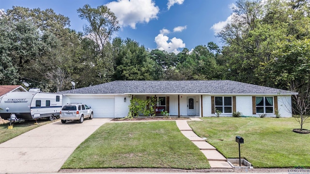 single story home with a porch, a garage, and a front yard