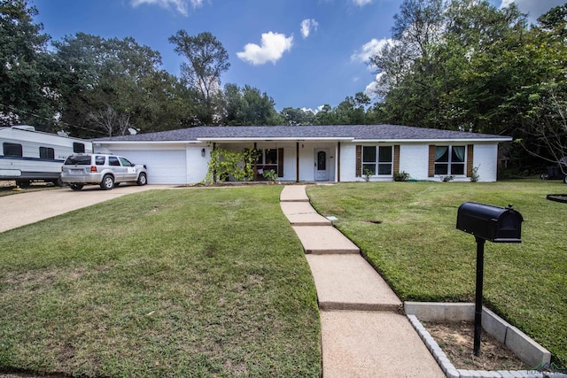 ranch-style house featuring a garage and a front yard