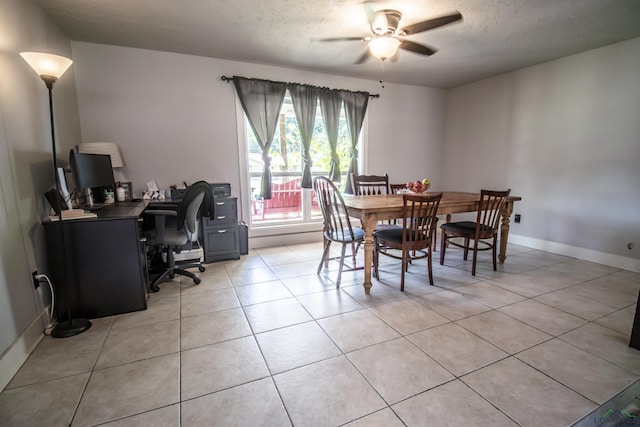 dining room featuring light tile patterned floors, a textured ceiling, and ceiling fan