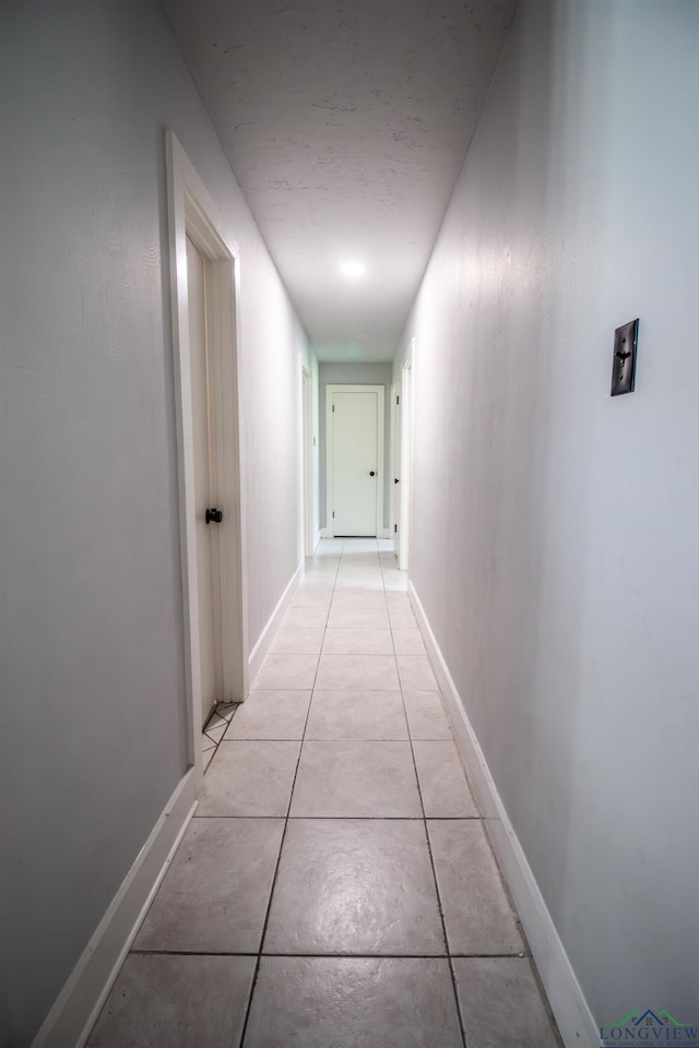 hallway with light tile patterned flooring