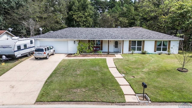 ranch-style home featuring a front yard, a porch, and a garage