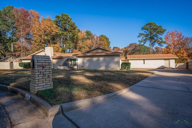 ranch-style home with a front yard