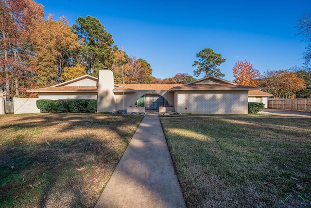 ranch-style home with a front yard