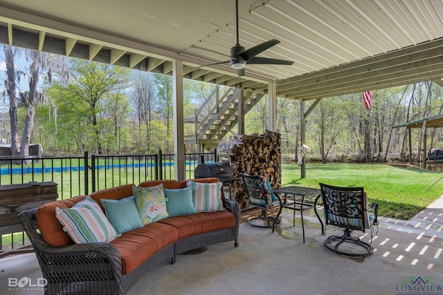 view of patio featuring an outdoor hangout area and ceiling fan