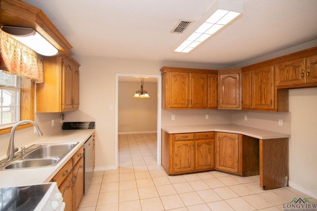 kitchen with pendant lighting, dishwasher, an inviting chandelier, sink, and light tile patterned floors