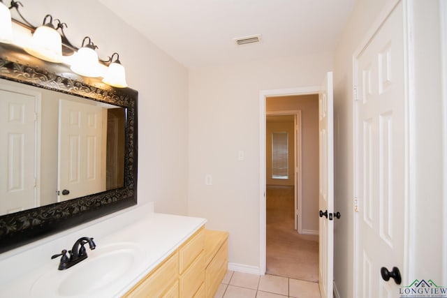 bathroom with tile patterned flooring and vanity