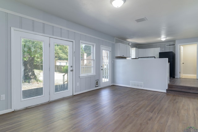 kitchen with white cabinets, dark hardwood / wood-style flooring, and a wealth of natural light