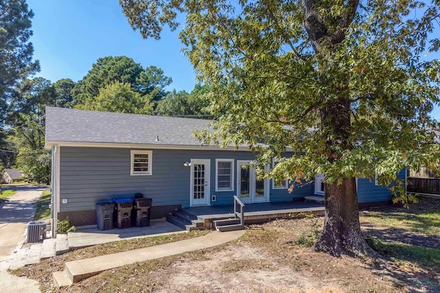 rear view of property featuring french doors