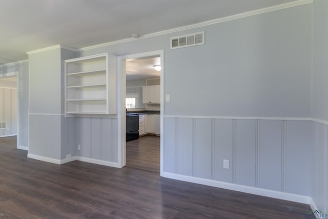 spare room with crown molding and dark hardwood / wood-style flooring