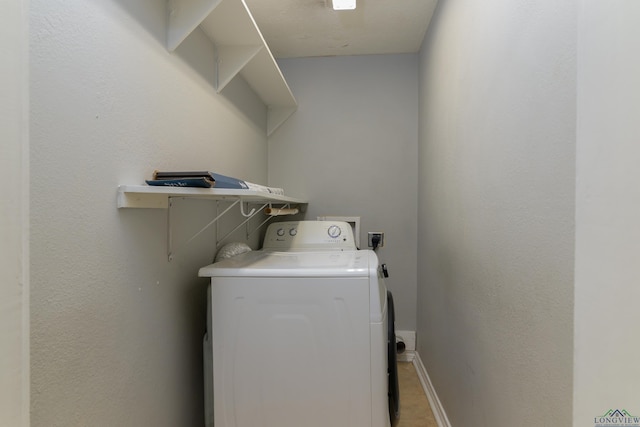 washroom with washer / dryer