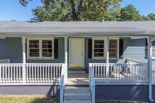 doorway to property with a porch