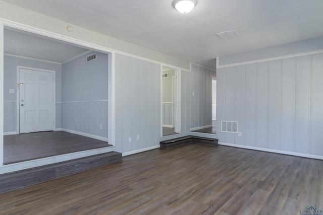 spare room with dark wood-type flooring