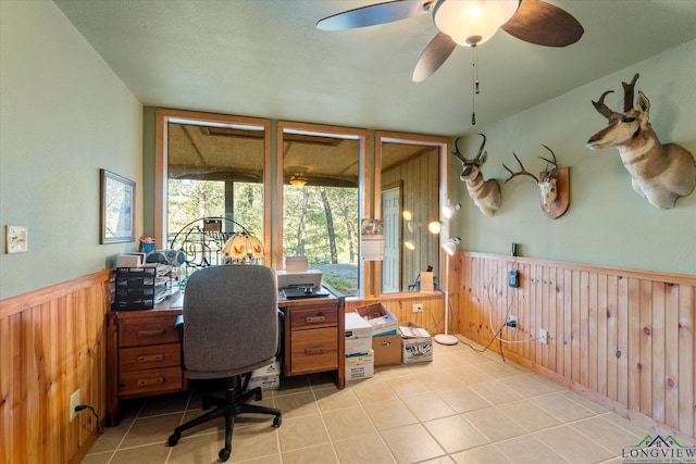 tiled office space featuring ceiling fan